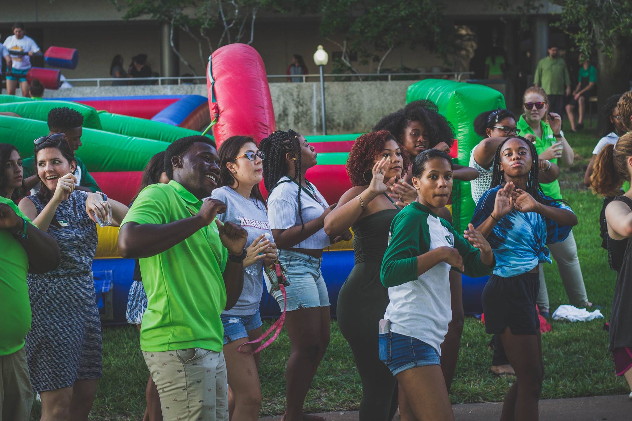 Students outdoors dancing in sync during USF week